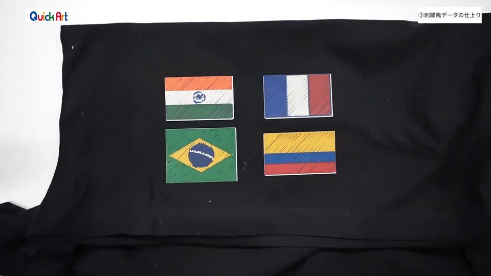 黒いTシャツに刺繍風の国旗4つ(インド・フランス・ブラジル・コロンビア)を白トナーでプリントした仕上がり